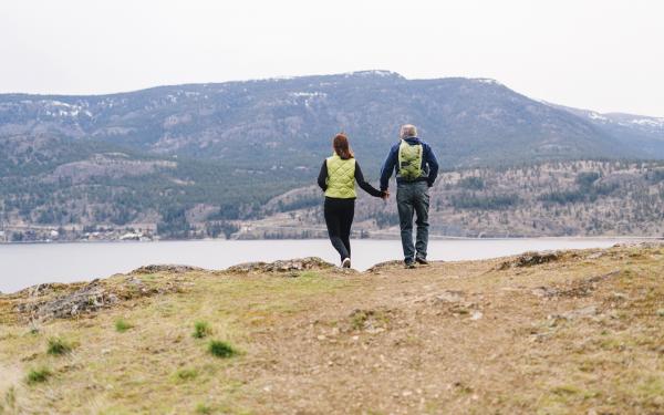 Couple taking a walk by a mountain side