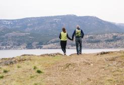 Couple taking a walk by a mountain side